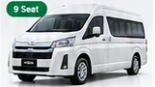 Toyota Hiace Luxury BAZE putih dengan label 9 Seat pada gambar