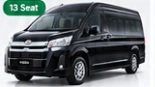 Toyota Hiace Premio VIP hitam dengan label 13 Seat pada gambar